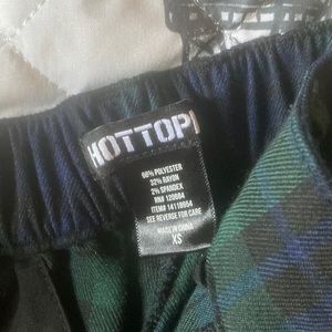 green and black striped pants